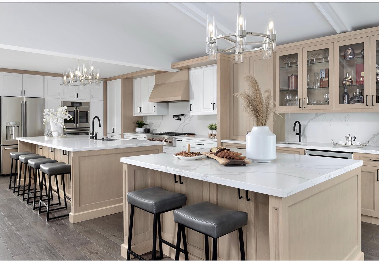 Professionally photographed kitchen with precisely aligned full-height stone surfaces
